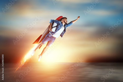 A man flies on a rocket, delivers parcels. Super fast delivery, cool service, online purchase. Copy space, Mixed media photo