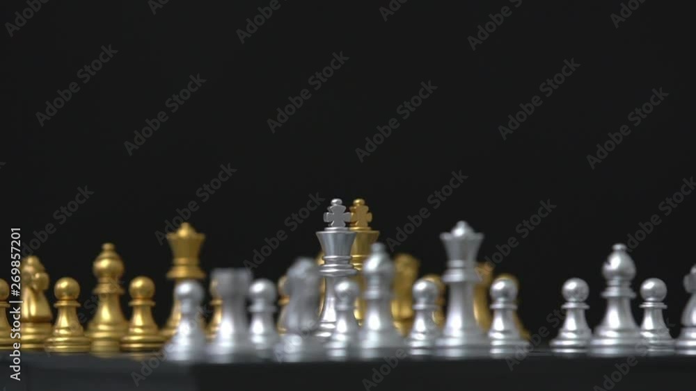 Chess figures rotating on board with black background,business concept Chess figures rotating on board with black background,business concept