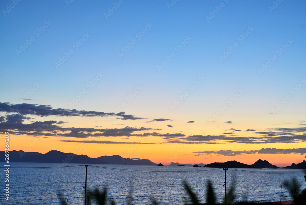 Beautiful seascape at sunset over the sea with blue pastel colors at Turgutreis, Bodrum, Turkey