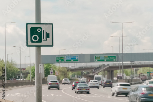 Highway interchange and speed camera sign for use for background © CupOfSpring