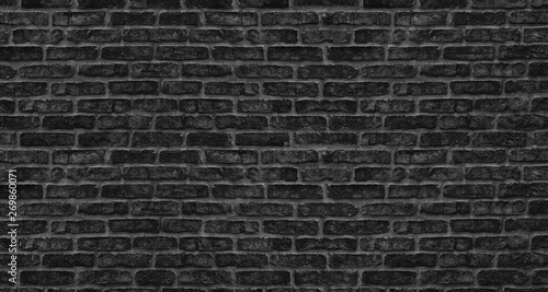 Black brick wall texture. Old rough brickwork. Dark grunge background