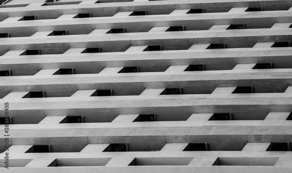 Bottom view of skyscraper concrete building. Looking up view in apartment building in the city. Real estate and corporate construction. Multi-storey residential building. Condo. Exterior architecture Bottom view of skyscraper concrete building. Looking up view in apartment building in the city. Real estate and corporate construction. Multi-storey residential building. Condo. Exterior architecture