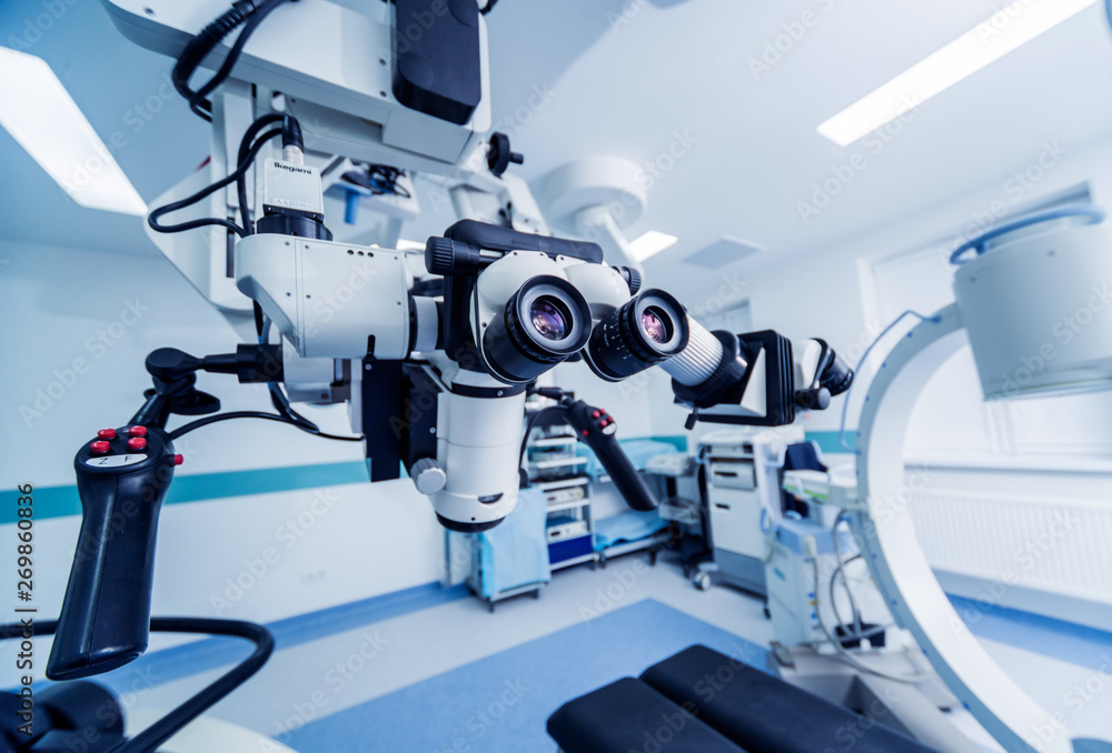 Modern microscope for operations in surgery room at the hospital. Modern microscope for operations in surgery room at the hospital.