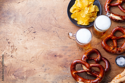 Beer, salted pretzels, potato chips Top view. Copy space
