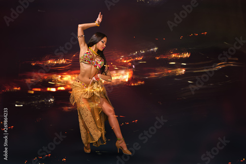 Young woman performing belly dance photo