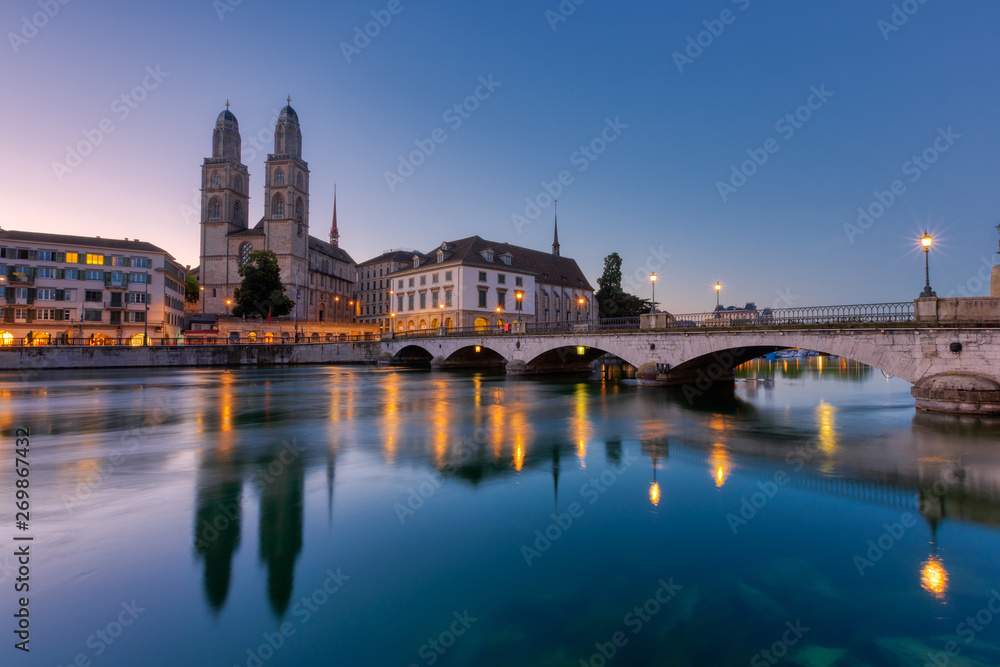 Grossmunster Church by limmat river in Zurich old town at night