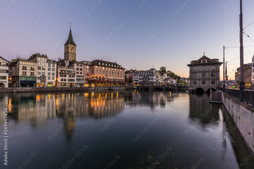 Beautiful view of old town zurich by limmat river before sunrise