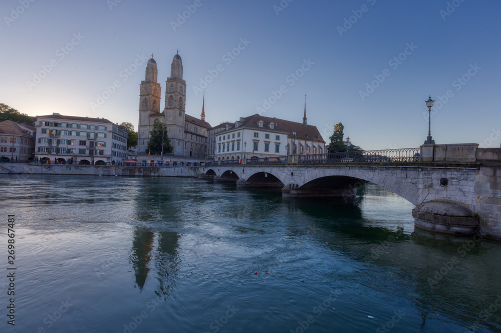 Grossmunster Church by limmat river in Zurich old town at night