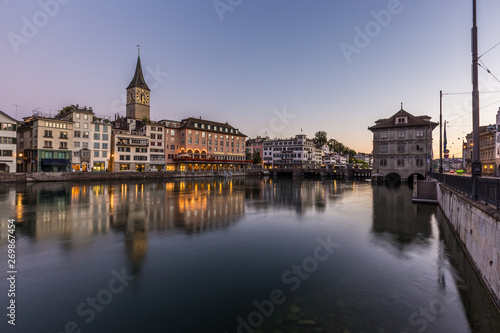 Beautiful view of old town zurich by limmat river before sunrise