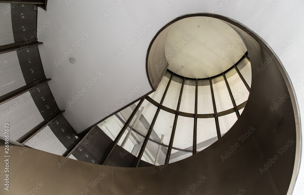 Obraz premium white color spiral stairs bottom view