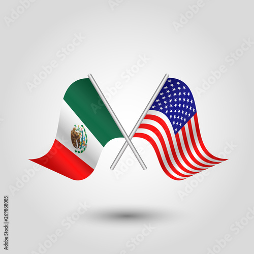 vector two crossed american and mexican flags on silver sticks - symbol of united states of america and mexico