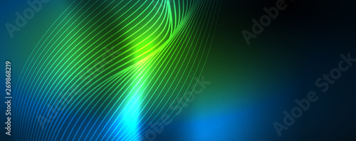 Smooth wave lines on blue neon color light background. Glowing abstract wave on dark, shiny motion, magic space light