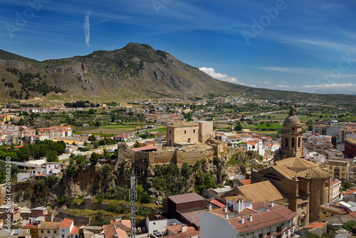 Fertile genil river valley at Loja Spain with Church of the Incarnation and Moorish Alcazaba fortress under Gorda Peak