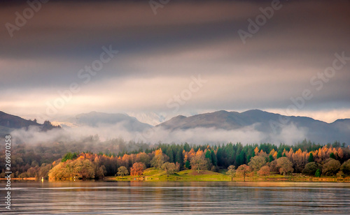 Autumn misty morning at windermere lake photo
