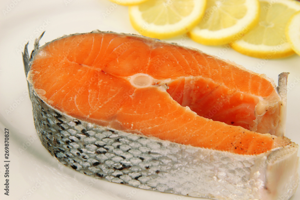 fresh raw salmon on white plate fresh raw salmon on white plate