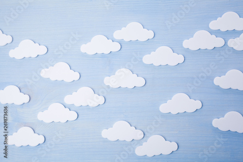 white clouds on a blue wooden background