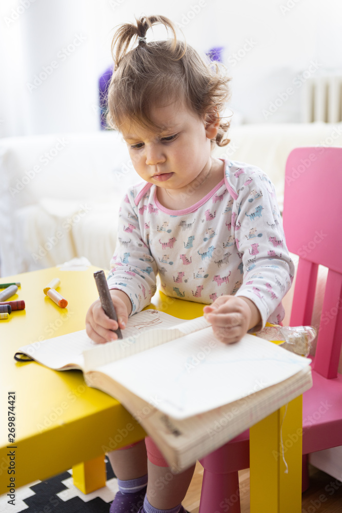 toddler girl drawing with crayons on paper toddler girl drawing with crayons on paper