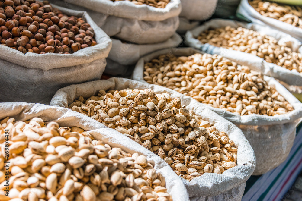 Naklejka premium Dried food products sold at the Chorsu Bazaar in Tashkent