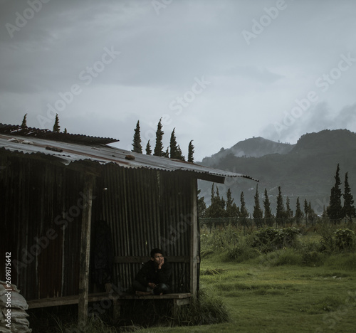 Man sitting alone with a beautiful backdrop (ID: 269875642)