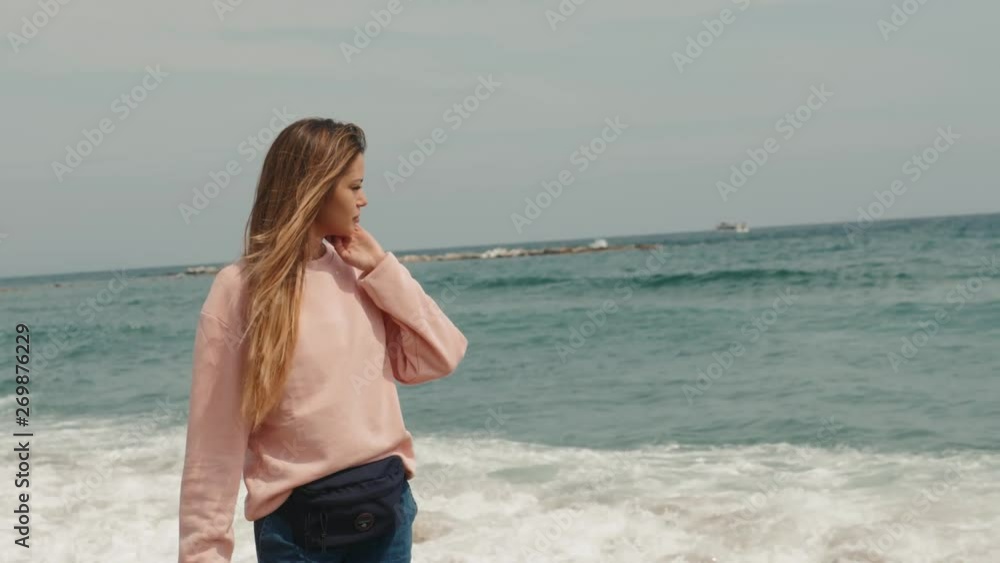 Portrait brunette woman sea, happy student girl smiling cute close up near ocean waves, spain barcelona Portrait brunette woman sea, happy student girl smiling cute close up near ocean waves, spain barcelona