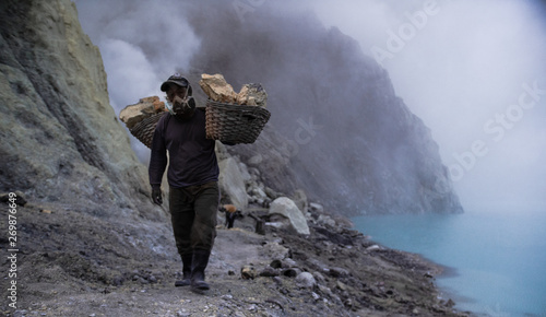 Sulfer Miner walking in an active volcanic crater (ID: 269876649)