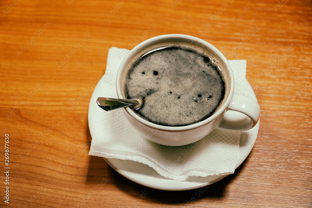 Obraz premium Cup of coffee on a saucer