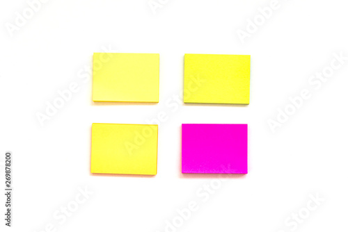 Blank multi-colored paper blocks for notes on white background. View from above with copy space