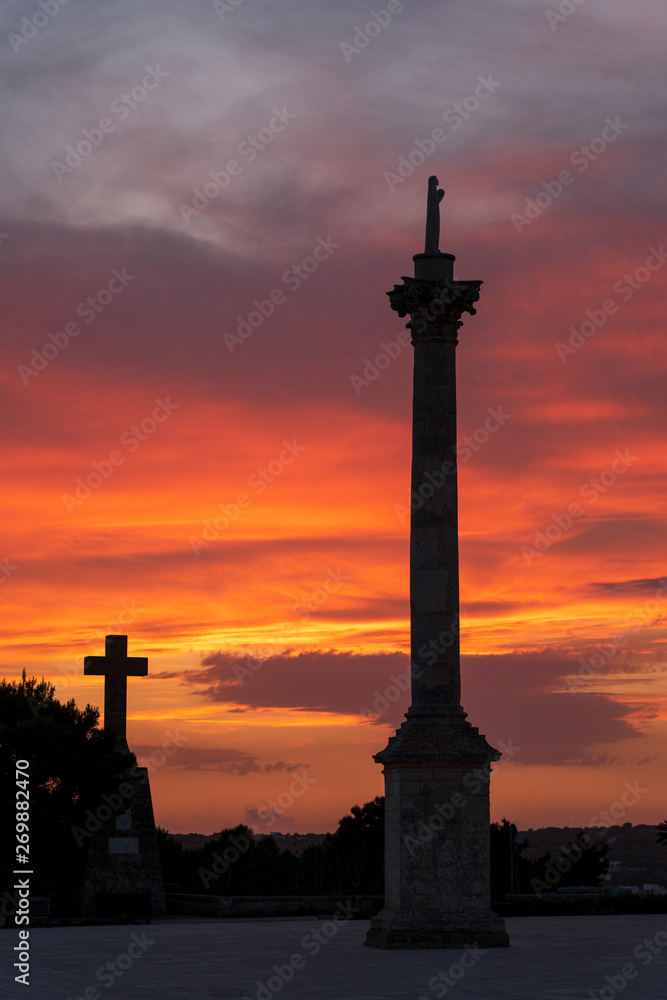 Sunset at Santa Maria di Leuca. Santa Maria di Leuca, Colonna Corinzia - Salento - Lecce - Apulia - Italy . Religious symbol, crucifix, cross - Immagine