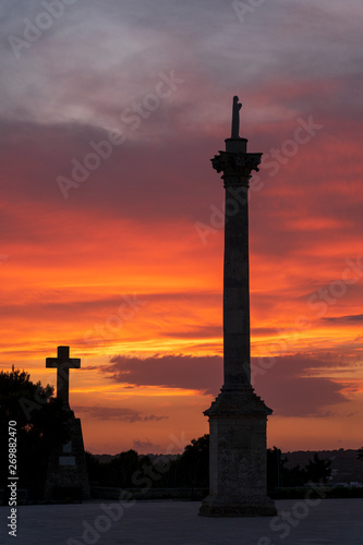 Sunset at Santa Maria di Leuca. Santa Maria di Leuca  Colonna Corinzia - Salento - Lecce - Apulia - Italy . Religious symbol  crucifix  cross - Immagine