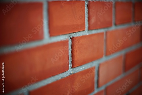 Perspective of a red brick wall, selective focus