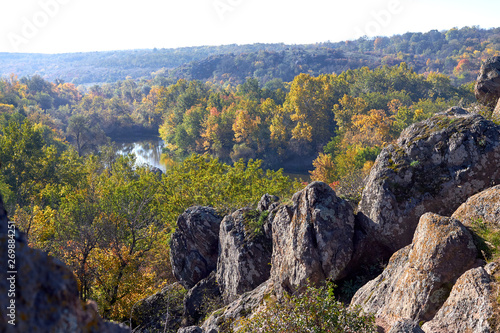 View of stones and river bank on sunny autumn morinig. View from above photo