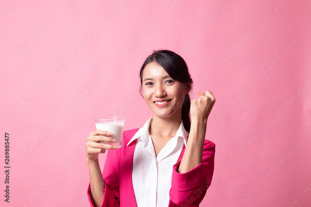 Healthy Asian woman drinking a glass of milk. Healthy Asian woman drinking a glass of milk.