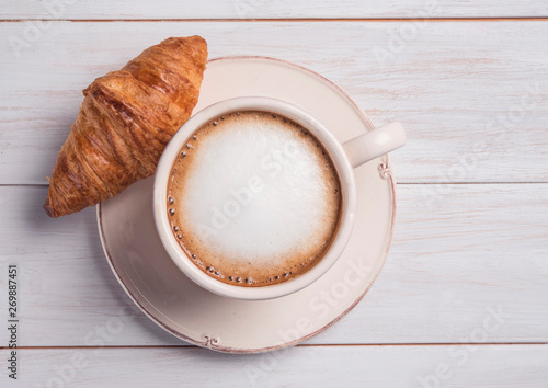 Fototapeta Naklejka Na Ścianę i Meble -  coffe and croissant wood background morning breakfast top view