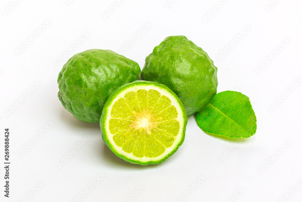 Natural fresh bergamot  fruit and sliced green leaf isolated on white background