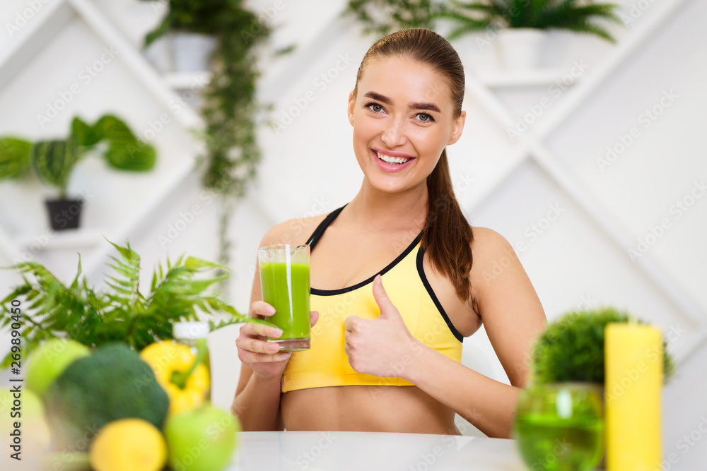 Fit Girl Recommending Healthy Smoothie, Showing Thumb Up Fit Girl Recommending Healthy Smoothie, Showing Thumb Up