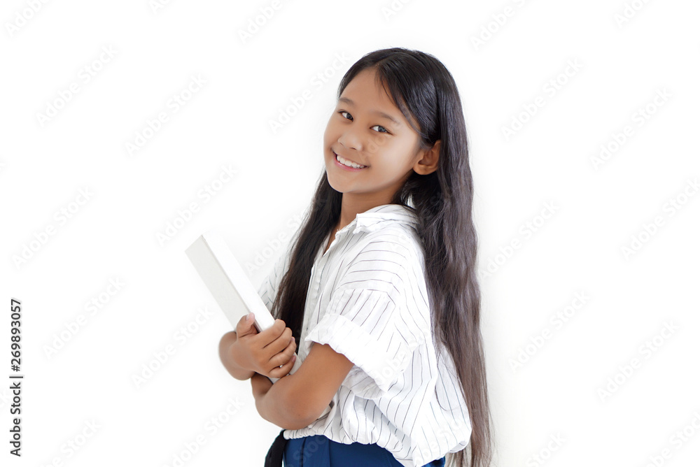 A girl smiling and holding or carrying big white book A girl smiling and holding or carrying big white book