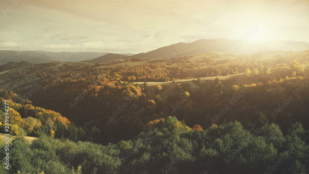 Epic Autumn Mountain Surface Scenery Aerial View. Panoramic Wild Nature Forest Landscape Overview. Multicolored Tree Hill Scene Eco Friendly Environment Concept Drone Flight