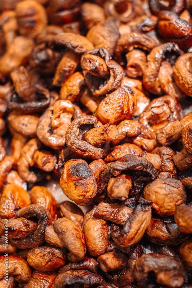 Juicy roasted mushrooms at the festival street food Juicy roasted mushrooms at the festival street food