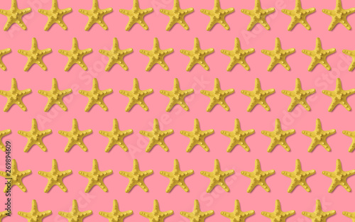 Starfish pattern on pink. Summer minimalistic background. Top view, flat lay
