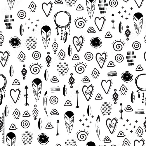 Hand drawn seamless pattern with cute tribal elements in simple style. Cute cartoon textured pattern. Vector.