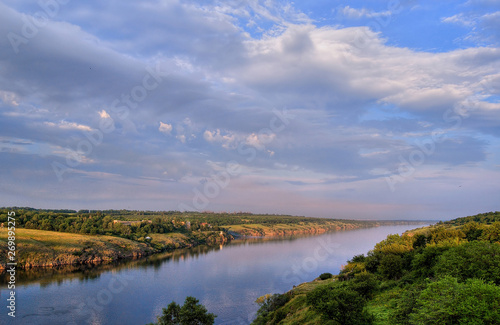 White clouds over a quiet river