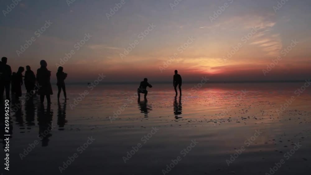 people taking pictures at sunset people taking pictures at sunset