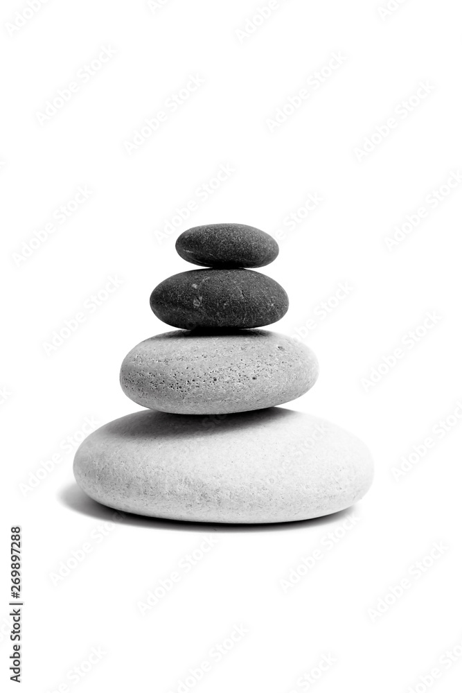 Stacked smooth grey stones. Sea pebble. Balancing pebbles isolated on white background Stacked smooth grey stones. Sea pebble. Balancing pebbles isolated on white background
