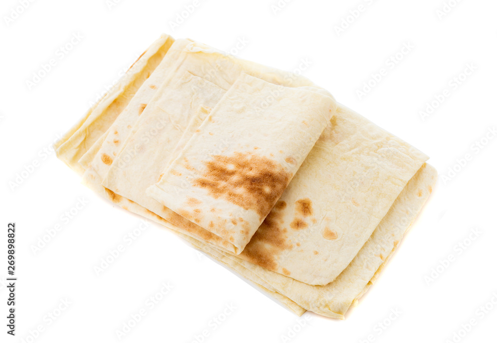 Thin pita bread on a white background. Armenian pita bread close-up.