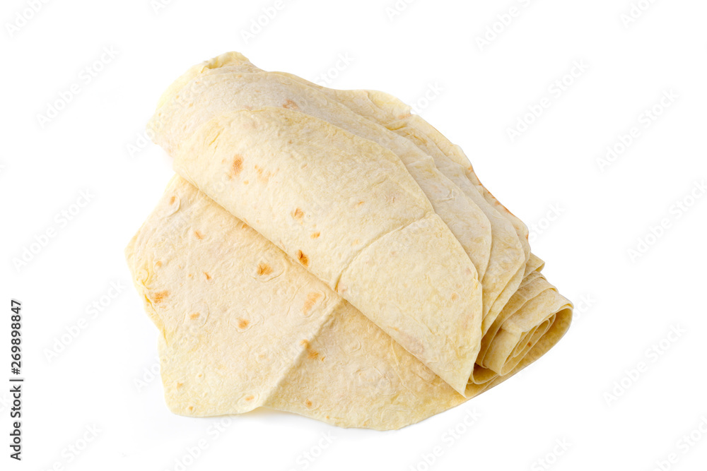 Thin pita bread on a white background. Armenian pita bread close-up. Thin pita bread on a white background. Armenian pita bread close-up.