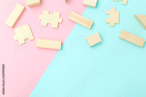 Ecological wooden toys on pastel background. Copy space