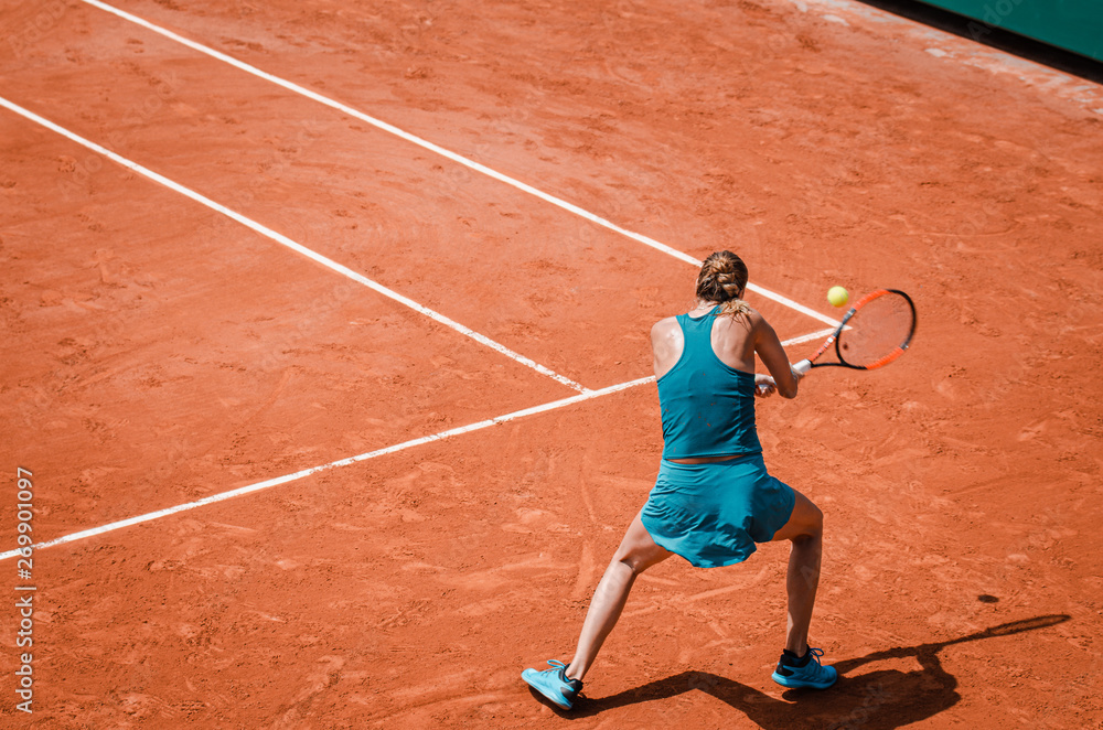 Obraz premium Backhand swing of woman playing tennis