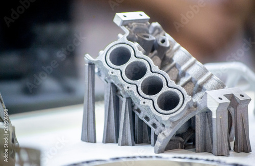Photography Man is holding object printed on metal 3d printer.