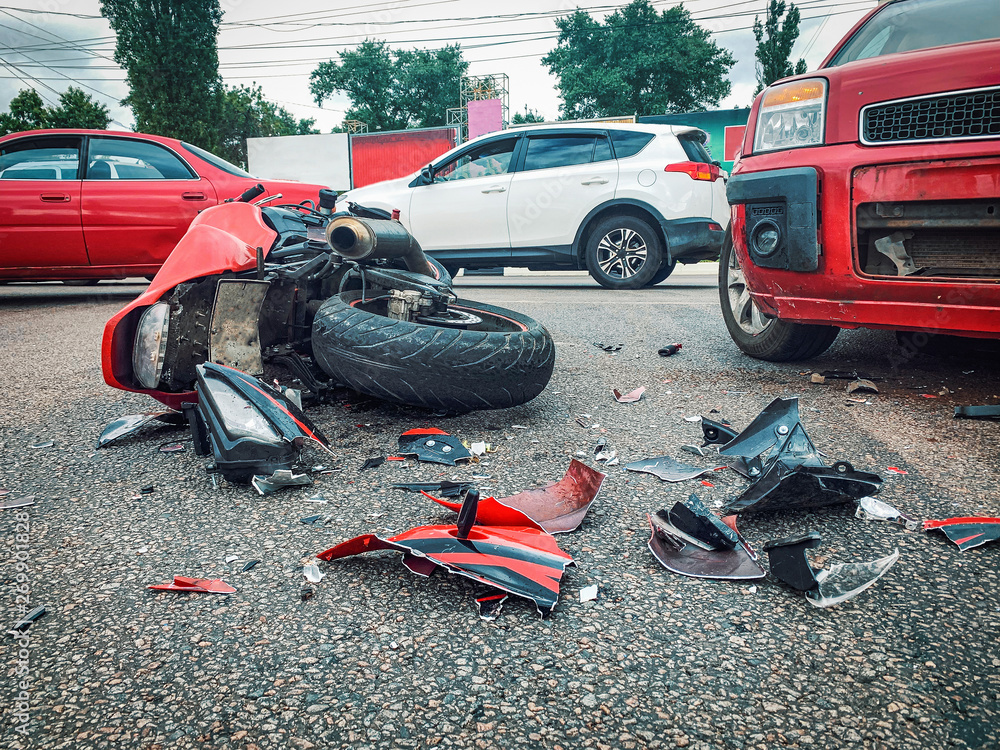 Motorcycle bike accident and car crash, broken and wrecked moto on road  Stock Photo | Adobe Stock