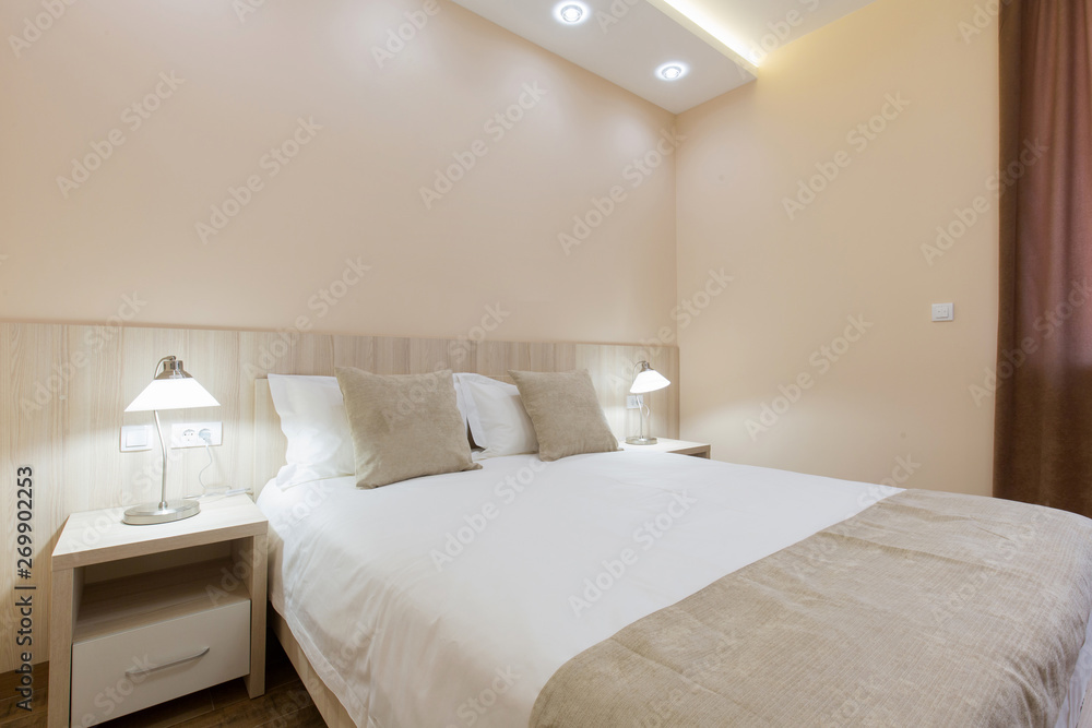 Hotel room interior, beige bedroom Hotel room interior, beige bedroom